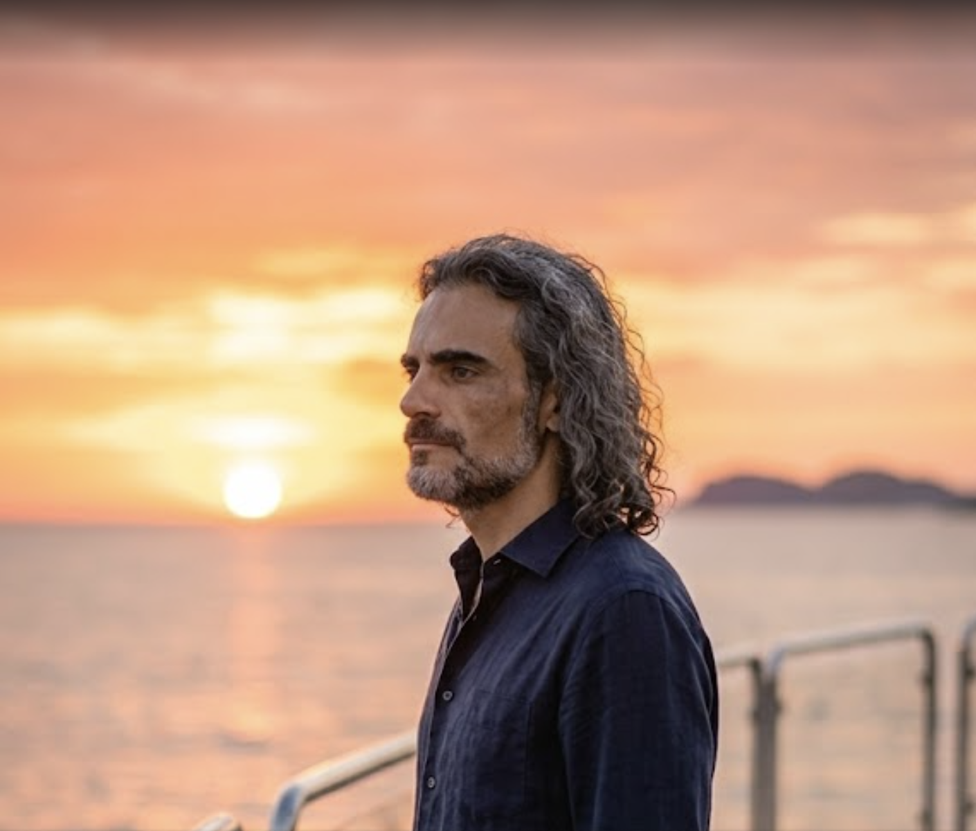 A. Adrian by the sea at sunset